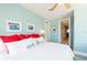 Relaxing bedroom with soft colors, natural light, and comfortable bedding, creating a peaceful and inviting atmosphere at 2201 Avenue C, Bradenton Beach, FL 34217