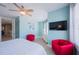 Stylish bedroom with comfortable seating, television, and a serene ambiance, providing a perfect space for relaxation at 2201 Avenue C, Bradenton Beach, FL 34217