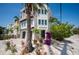 Charming two-story coastal home with a lush, landscaped yard, two-car garage and outdoor balconies at 2201 Avenue C, Bradenton Beach, FL 34217