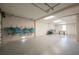 Spacious garage with ample storage for beach gear, equipment, and a foosball table at 2201 Avenue C, Bradenton Beach, FL 34217