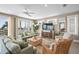 Inviting living room featuring stylish furnishings, a large TV, and access to a spiral staircase and a balcony at 2201 Avenue C, Bradenton Beach, FL 34217