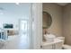 Stylish powder room featuring modern sink, neutral tones, and a glimpse into the living area at 2201 Avenue C, Bradenton Beach, FL 34217