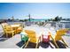 Rooftop deck with outdoor seating and stunning panoramic views of the ocean on a bright, sunny day at 2201 Avenue C, Bradenton Beach, FL 34217