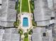 Aerial view showcasing the community pool nestled among residential buildings at 2503 Beneva Rd # 7, Sarasota, FL 34232