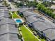 Aerial view showcases well-maintained community with lush green spaces, inviting pool and manicured lawns at 2503 Beneva Rd # 7, Sarasota, FL 34232