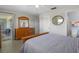 Spacious bedroom featuring wood floors, a dresser, and access to a porch and bathroom, offering comfort at 2503 Beneva Rd # 7, Sarasota, FL 34232