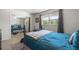 Bedroom with large window, mirrored closet doors, ceiling fan, and hardwood flooring at 2503 Beneva Rd # 7, Sarasota, FL 34232