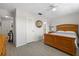 Cozy bedroom featuring wood floors, a wooden bed, and an ensuite bathroom view, offering a tranquil retreat at 2503 Beneva Rd # 7, Sarasota, FL 34232