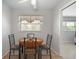 Cozy dining area with modern fixtures and bright window at 2503 Beneva Rd # 7, Sarasota, FL 34232