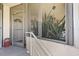 Front entrance with screen door, and close-up of indoor house plant at 2503 Beneva Rd # 7, Sarasota, FL 34232