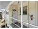 Condo entrance with a well-lit porch at 2503 Beneva Rd # 7, Sarasota, FL 34232
