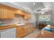 Charming kitchen with light wood cabinetry, updated appliances, and an eat-in dining area at 2503 Beneva Rd # 7, Sarasota, FL 34232
