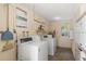 Functional on-site laundry room with multiple washers and dryers for residents' convenience at 2503 Beneva Rd # 7, Sarasota, FL 34232