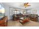 Cozy living room featuring wood flooring, ceiling fan, and comfortable seating, leading to the front door at 2503 Beneva Rd # 7, Sarasota, FL 34232