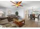 Relaxing living room with comfortable seating, wood floors, and a view into the adjacent dining area at 2503 Beneva Rd # 7, Sarasota, FL 34232