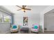 Cozy living room showcases decor, seating, art, and natural light from the large window at 2503 Beneva Rd # 7, Sarasota, FL 34232