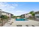 Beautiful community pool area with ample lounge chairs and well-manicured landscaping surrounded by residences at 2503 Beneva Rd # 7, Sarasota, FL 34232