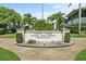 Exterior view of the Forest Lakes Country Club Estates Condominium entrance sign surrounded by well-maintained landscaping at 2503 Beneva Rd # 7, Sarasota, FL 34232