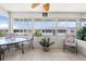 Well-lit sunroom with large windows, comfortable seating, and tile flooring at 2503 Beneva Rd # 7, Sarasota, FL 34232