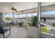 Bright sunroom filled with natural light, tiled floor, and sliding glass door at 2503 Beneva Rd # 7, Sarasota, FL 34232