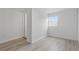 This light and bright bedroom features wood-look flooring and neutral paint at 2652 26Th St, Sarasota, FL 34234