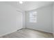 This is a simple bedroom with new flooring and a bright window with outside views at 2652 26Th St, Sarasota, FL 34234