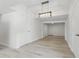 Open-concept dining room with modern lighting, hardwood floors, and access to multiple rooms at 2652 26Th St, Sarasota, FL 34234