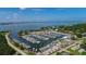 Aerial view of a marina with a variety of boats and yachts, set against a scenic waterfront backdrop at 2702 45Th S St, Gulfport, FL 33711