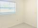 Clean, light-filled bedroom with a window providing natural light and outdoor views at 2702 45Th S St, Gulfport, FL 33711