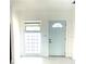 Bright entryway featuring a modern front door and sidelight window at 2702 45Th S St, Gulfport, FL 33711