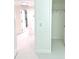Bright hallway featuring tiled flooring and doorways to other rooms and closet space at 2702 45Th S St, Gulfport, FL 33711
