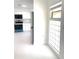 Bright kitchen view showcasing new appliances and white cabinetry at 2702 45Th S St, Gulfport, FL 33711
