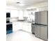Modern kitchen with stainless steel appliances and bright, white cabinets at 2702 45Th S St, Gulfport, FL 33711