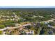 Scenic aerial view of a property showcasing lush greenery and waterways outlined in yellow at 31 Twig Ct, Port Charlotte, FL 33954