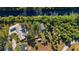 An aerial view of the property showing the home, detached garage, backyard bordering a canal, and property lines at 31 Twig Ct, Port Charlotte, FL 33954