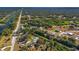 Aerial view of the property with yellow borders, showing greenery, waterways, and nearby houses at 31 Twig Ct, Port Charlotte, FL 33954