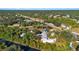 Picturesque overhead shot of residences near waterways, amid roads and vibrant, verdant foliage at 31 Twig Ct, Port Charlotte, FL 33954