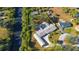 An aerial view of the property and home showcasing the property boundaries and proximity to the river at 31 Twig Ct, Port Charlotte, FL 33954