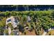 Aerial view highlighting the home, detached garage, and expansive backyard bordering a canal at 31 Twig Ct, Port Charlotte, FL 33954