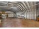 The metal barn features high ceilings and ample space for storage or a workshop at 31 Twig Ct, Port Charlotte, FL 33954
