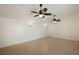 Large bonus room with dual ceiling fans, providing ample space for recreation or relaxation at 31 Twig Ct, Port Charlotte, FL 33954