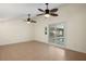 Bonus room with sliding door to pool featuring two ceiling fans, and tile flooring at 31 Twig Ct, Port Charlotte, FL 33954