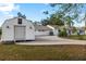 View of the property featuring a spacious garage and long driveway at 31 Twig Ct, Port Charlotte, FL 33954