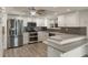 Modern kitchen with stainless steel appliances, granite countertops, and stylish backsplash, perfect for cooking and entertaining at 31 Twig Ct, Port Charlotte, FL 33954