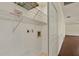 Functional laundry area equipped with shelving and storage solutions at 31 Twig Ct, Port Charlotte, FL 33954