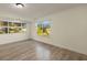 Spacious living room with large windows offering great natural light and views of the surrounding landscape at 31 Twig Ct, Port Charlotte, FL 33954