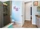 Bright bathroom with walk-in shower, vanity, and an open doorway to bedroom at 312 148Th Ne Ct, Bradenton, FL 34212