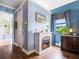 Cozy bedroom with a fireplace, hardwood floors, and a large window for natural light at 312 148Th Ne Ct, Bradenton, FL 34212