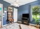 Relaxing bedroom offering a fireplace, closet space, and a beautiful view of the outside pond at 312 148Th Ne Ct, Bradenton, FL 34212