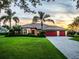 Charming home with mature landscaping and a three-car garage at 312 148Th Ne Ct, Bradenton, FL 34212